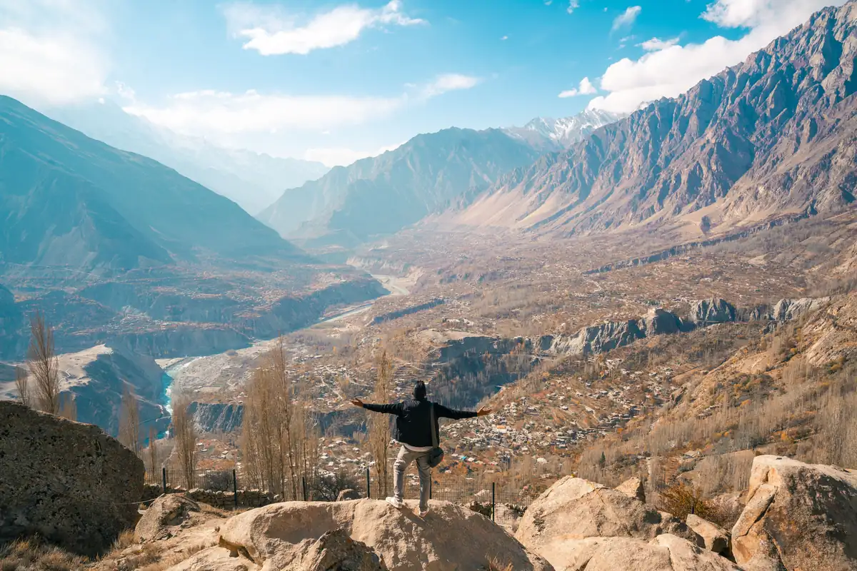 A viewpoint over Hunza A traveller looking out over the Hunza Valley and the Karakoram mountains