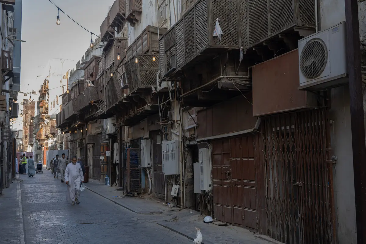 Traditional balconies above a street in historic Al-Balad