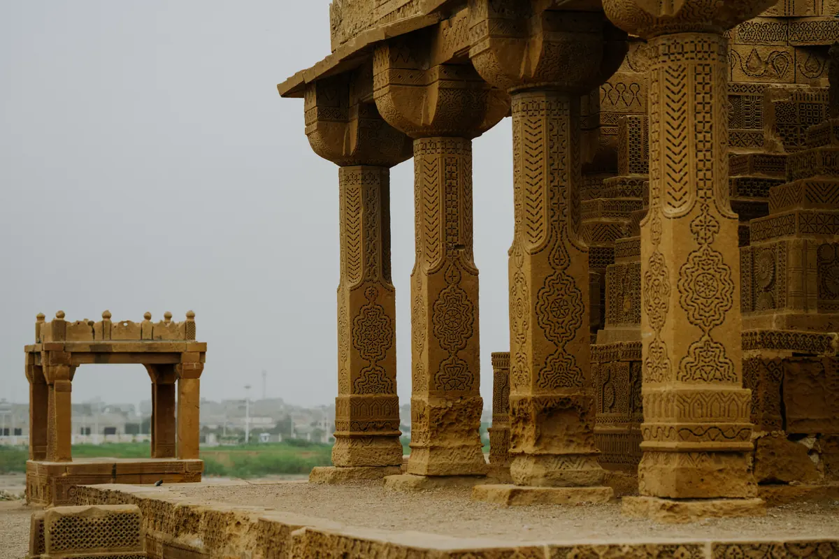 Carved sandstone pillars and tomb structures at Chaukhandi