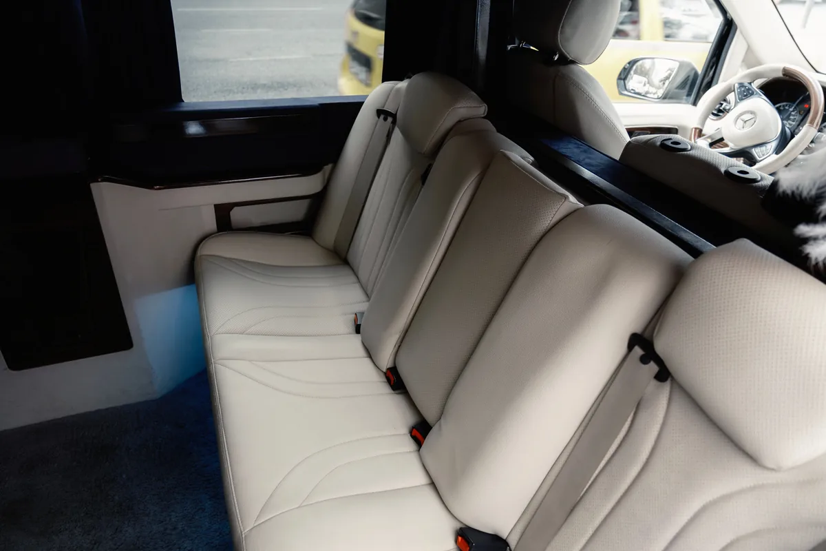 Inside a passenger van Rows of upholstered seats inside a modern passenger van