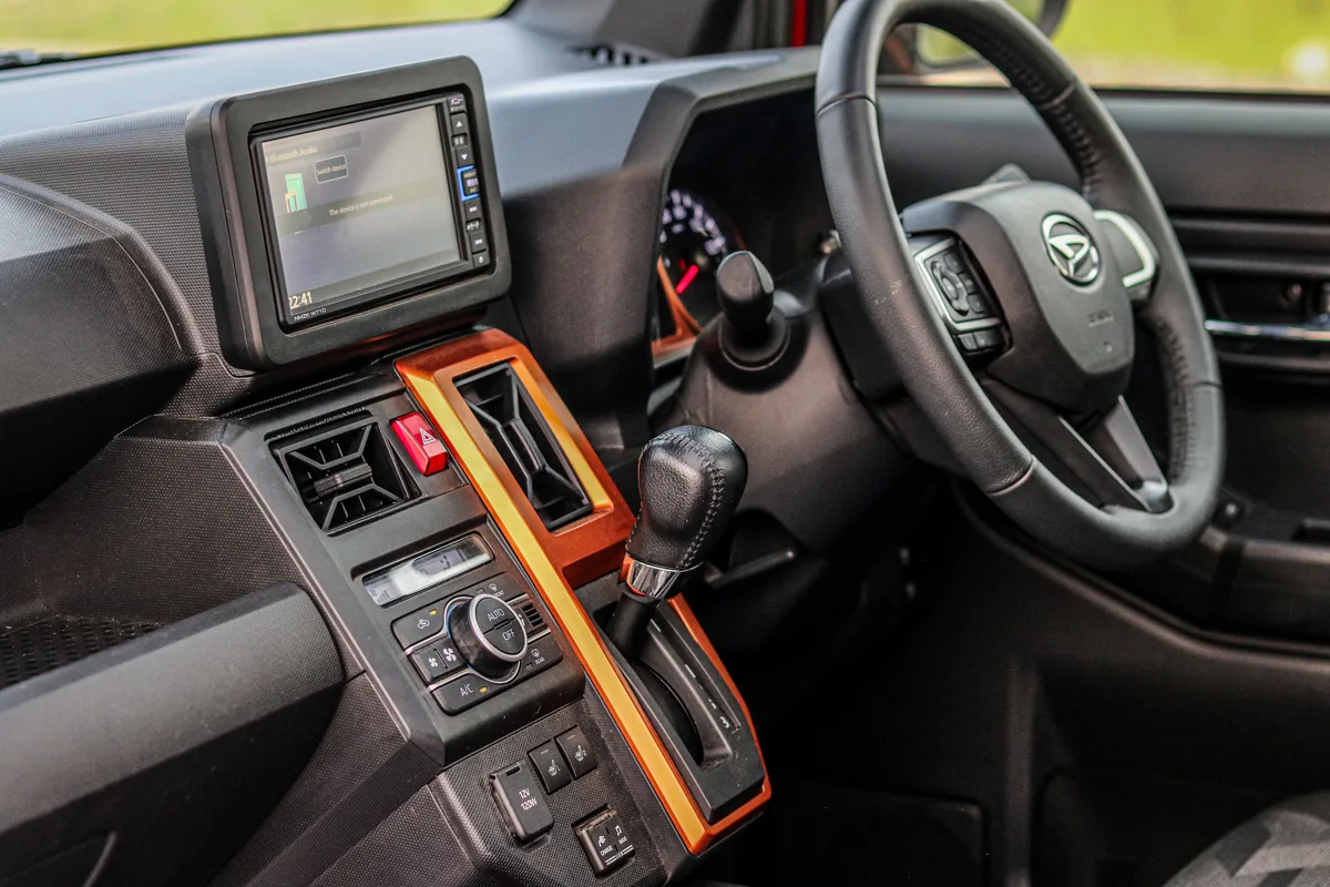 Car dashboard with a steering wheel and central display