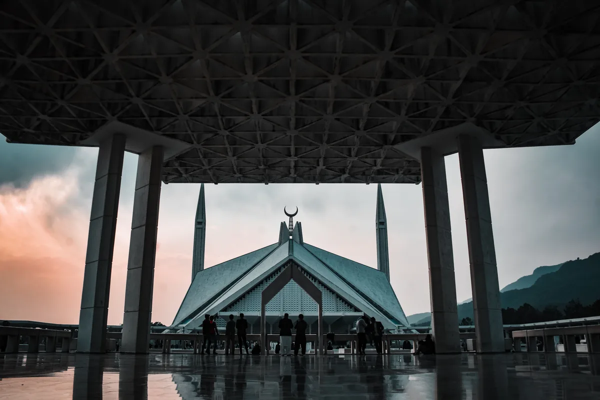 Islamabad at twilight Faisal Mosque beneath a twilight sky in Islamabad